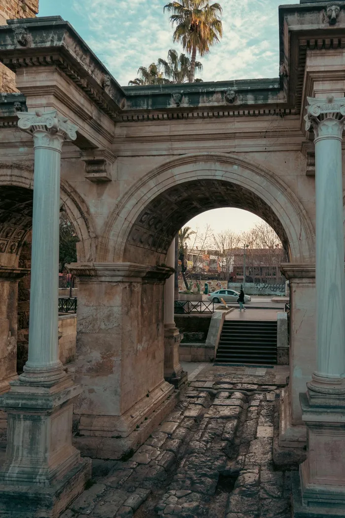 Hadrian's Gate in Antalya, Turkey — a Roman triumphal arch in the heart of the old town, close to the specialist dental clinics serving UK All-on-6 patients